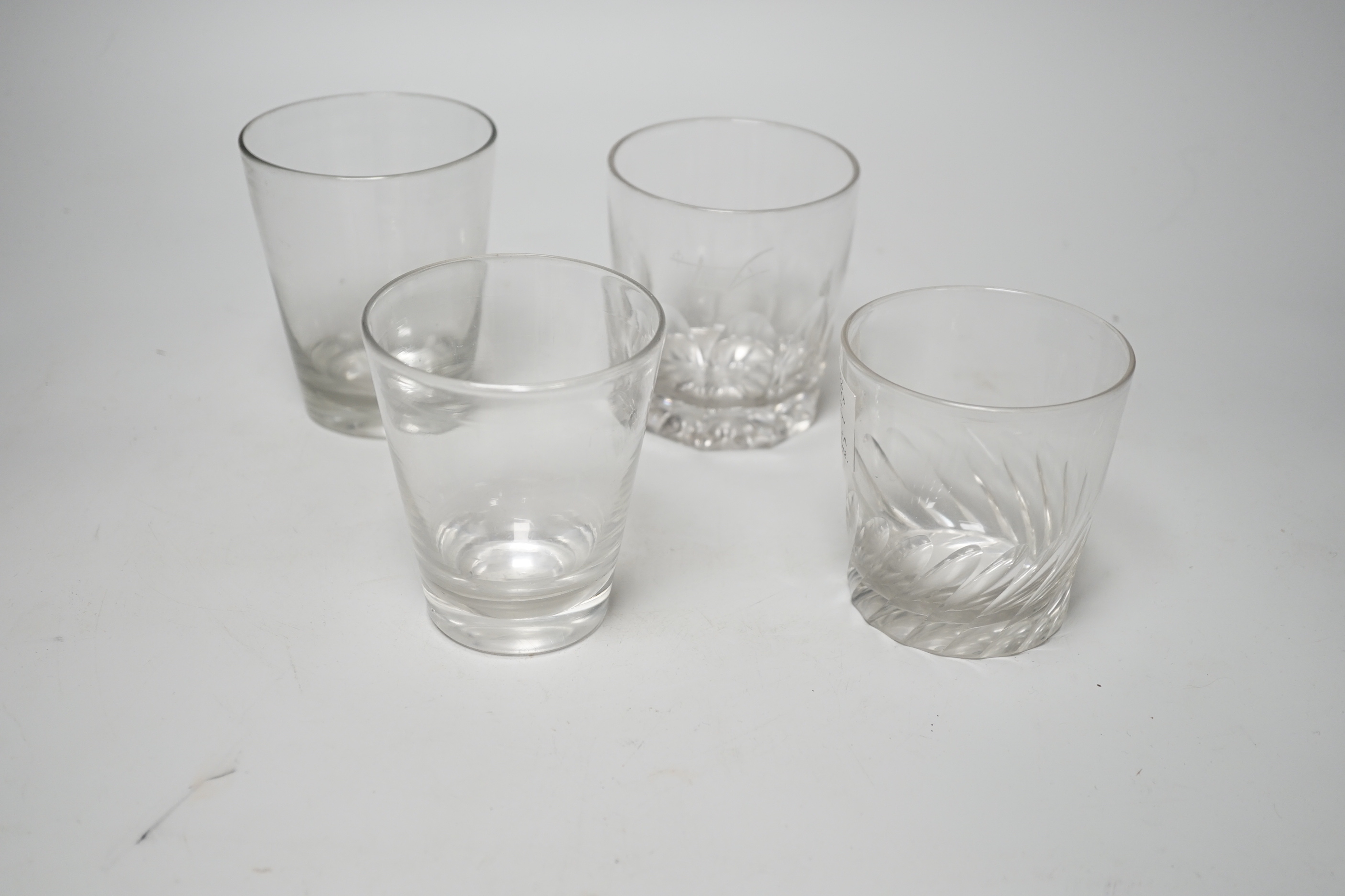 Four Georgian English lead crystal tumblers, one earlier example c.1770, with rare, wide, ground and polished pontil area, 11.5cm high